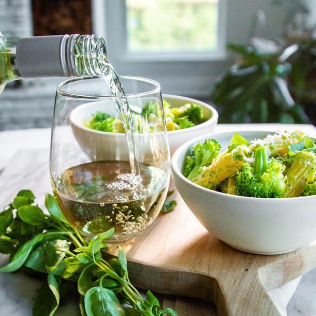 broccoli pesto and wine pour
